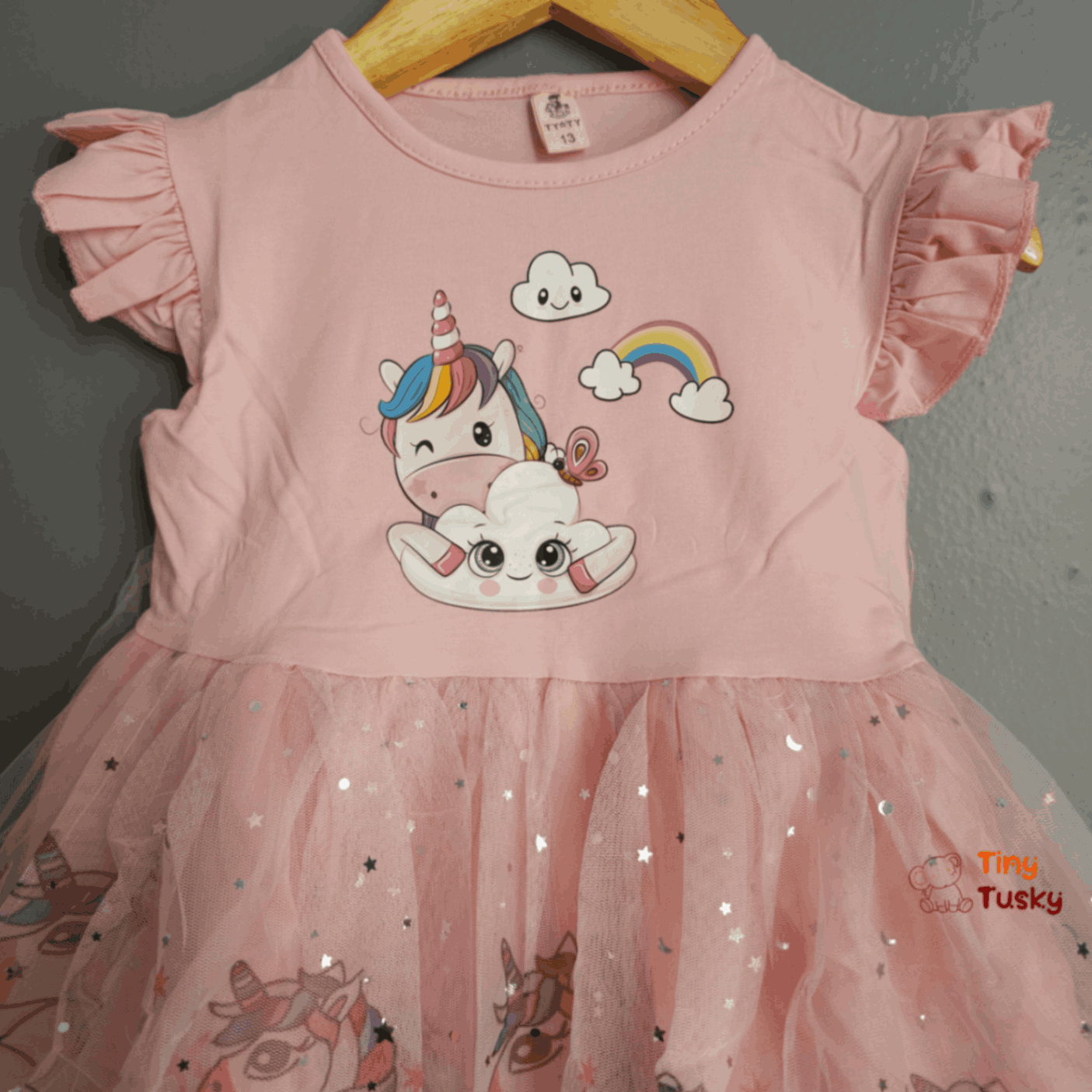 Tiny Tusky Girls Magical Unicorn Casual Dress! This comfortable dress is crafted from a soft, lightweight fabric that's perfect for all-day wear.