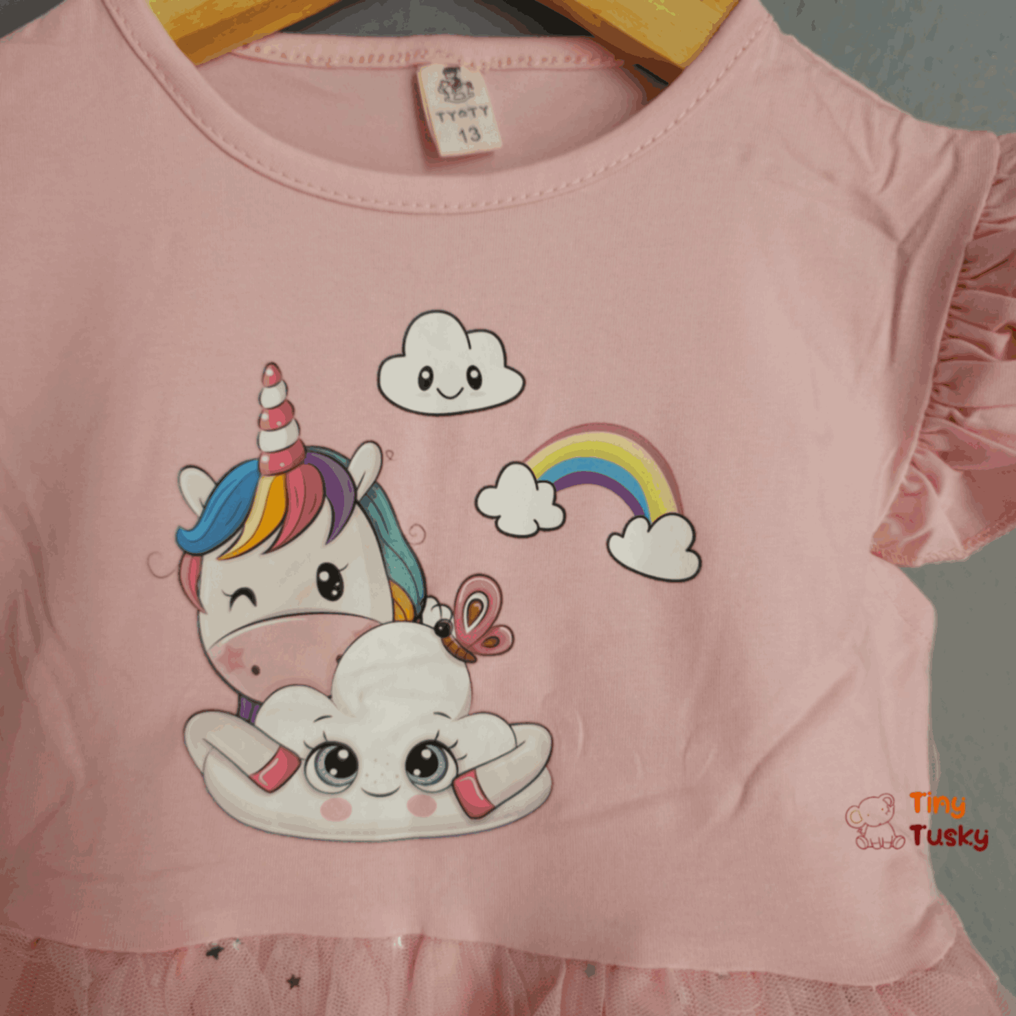 Tiny Tusky Girls Magical Unicorn Casual Dress! This comfortable dress is crafted from a soft, lightweight fabric that's perfect for all-day wear.