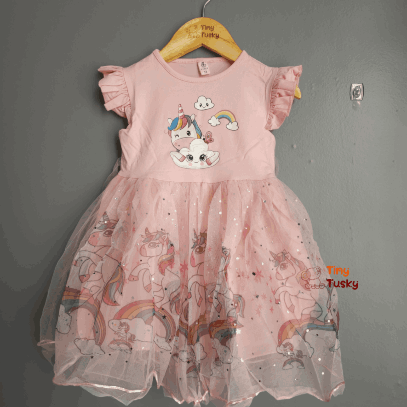 Tiny Tusky Girls Magical Unicorn Casual Dress! This comfortable dress is crafted from a soft, lightweight fabric that's perfect for all-day wear.