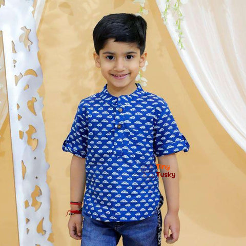 Tiny Tusky Boys Blue Cotton Car Shirt! Crafted from 100% breathable cotton, this comfortable shirt is perfect for keeping your boy cool and comfortable all day long. Featuring a playful car motif in a rich dark Blue color, this shirt is sure to spark his imagination and become a summertime favorite.